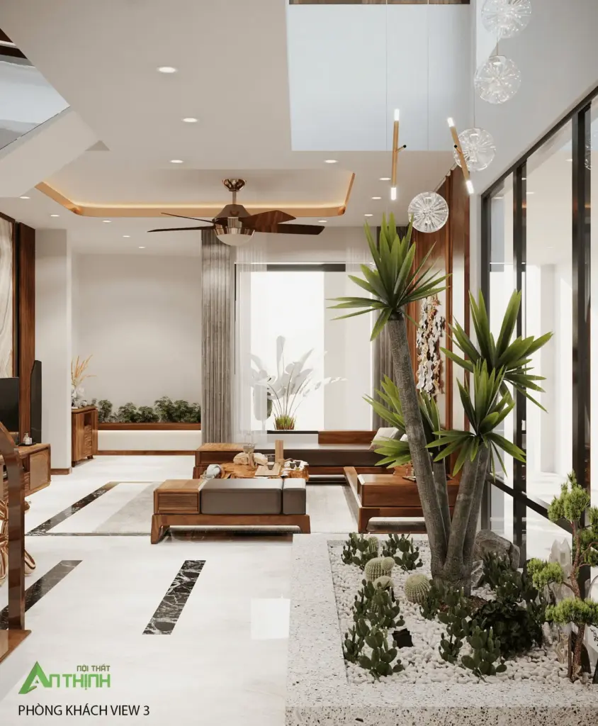 Góc nhìn từ tiểu cảnh – cầu thang trắng lan can kính, bộ sofa gỗ thoáng, sàn marble trắng viền đen, cây xương rồng lớn làm điểm nhấn sống động