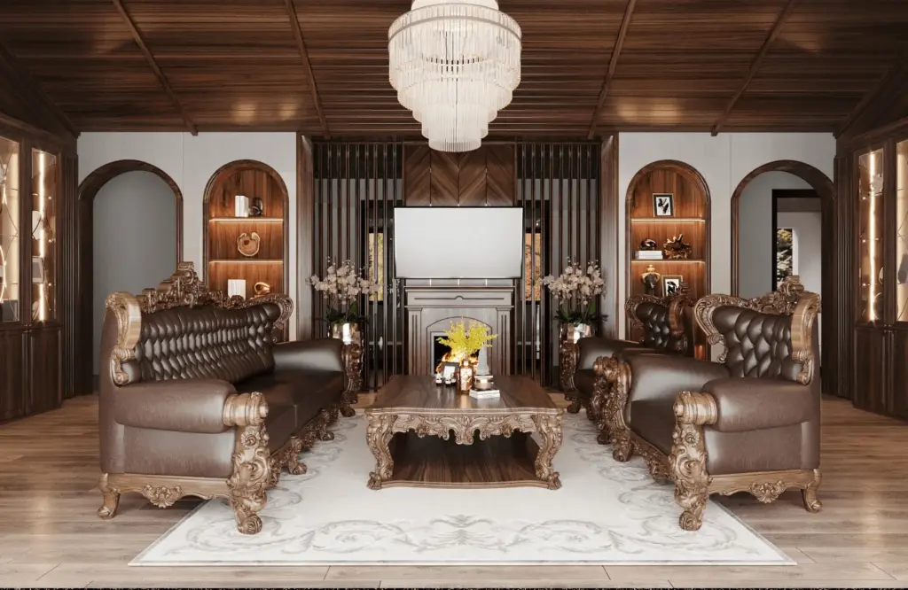 Phòng khách cổ điển sang trọng – bộ sofa da bò nâu đỏ chạm khắc vàng, bàn trà gỗ điêu khắc tinh xảo, đèn chùm pha lê, tủ trang trí hai bên vòm cuốn, trần ốp gỗ tự nhiên