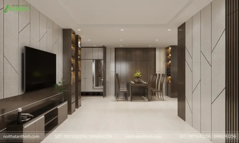 Không gian phòng khách – phòng ăn liên thông mở, vách ốp vải hai bên tạo chiều sâu thị giác cho toàn bộ căn hộ